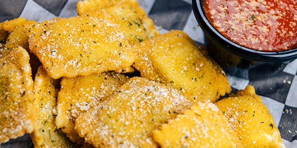 Greco's fried raviolis served with a side of marinara dipping sauce from the appetizer menu