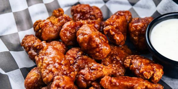 Greco's boneless BBQ sauce tossed wings menu served with ranch dipping sauce