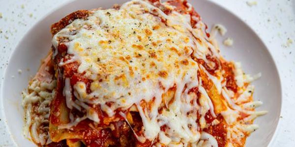 Greco's lasagna topped with cheese served on the Italian specialties pasta menu